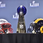 ATLANTA, GA - JANUARY 30: The Vince Lombardi Trophy sits on a table between the New England Patriots and Los Angeles Rams helmets prior to NFL American Football Herren USA Commissioner Roger Goodell s press conference PK Pressekonferenz at the Georgia World Congress Center on January 30, 2019, in Atlanta, GA. (Photo by Austin McAfee/Icon Sportswire) NFL: JAN 30 Super Bowl LIII - Commissioner Roger Goodell Press Conference