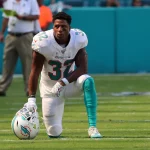 October 13, 2019, Miami Gardens, Florida, USA: Miami Dolphins running back Kenyan Drake (32) watches a replay on the scr