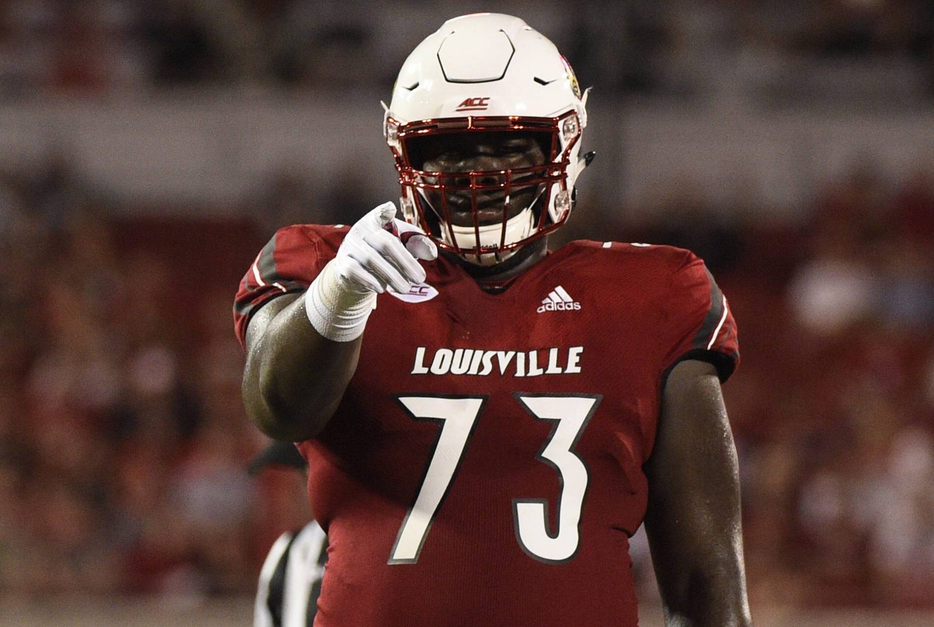 September 15 2018 Louisville Cardinals offensive lineman Mekhi Becton 73 points to the crowd of a