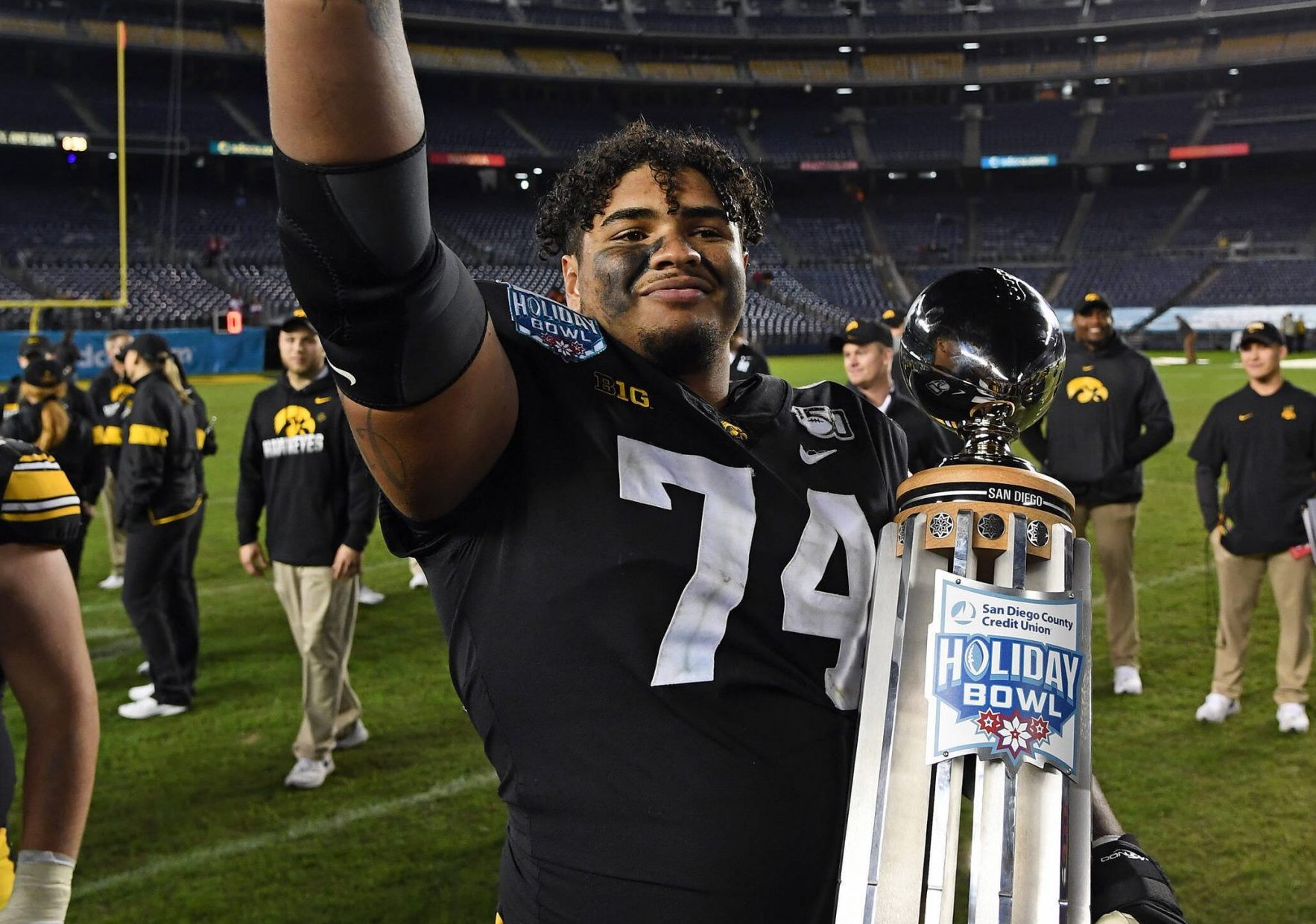 SAN DIEGO, CA - DECEMBER 27: Iowa Hawkeyes offensive lineman Tristan Wirfs 74 with the Holiday Bowl trophy after the Hawkeyes defeated the USC Trojans 49 to 24 in the Holiday Bowl played on December 27, 2019 at SDCCU Stadium in San Diego, CA. Photo by John Cordes/Icon Sportswire COLLEGE FOOTBALL: DEC 27 Holiday Bowl - USC v Iowa PUBLICATIONxINxGERxSUIxAUTxHUNxRUSxSWExNORxDENxONLY Icon506191227026