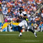 LOS ANGELES, CA - OCTOBER 06: Denver Broncos quarterback Joe Flacco (5) rolls out to pass during the NFL, American Footb