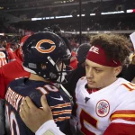 December 22, 2019, Chicago, IL, USA: Chicago Bears quarterback Mitch Trubisky hugs Kansas City Chiefs quarterback Patric