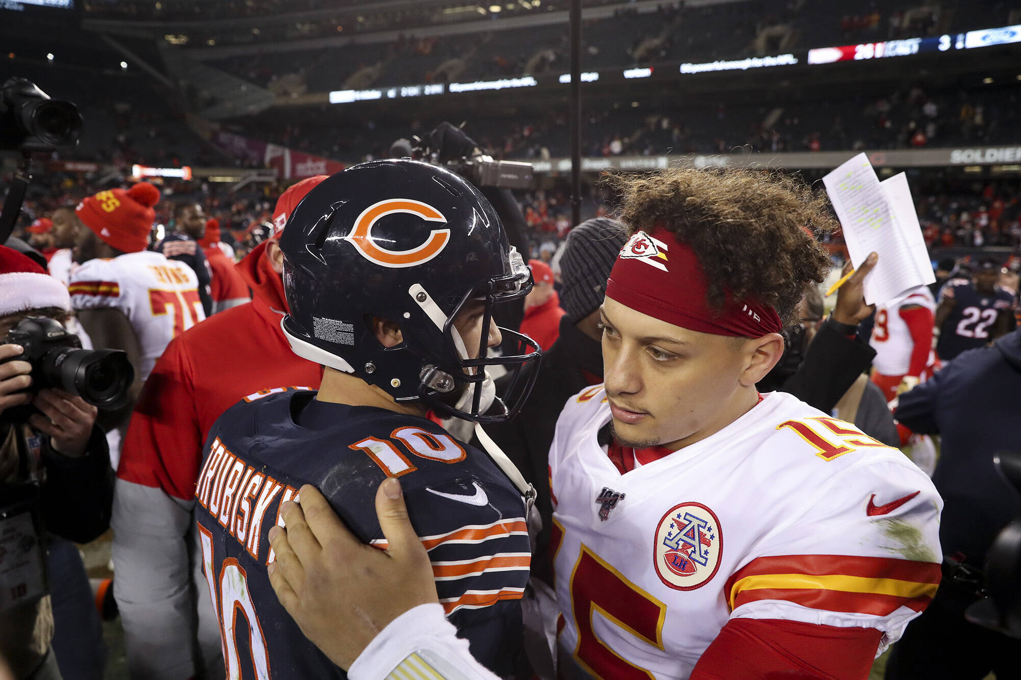 December 22, 2019, Chicago, IL, USA: Chicago Bears quarterback Mitch Trubisky hugs Kansas City Chiefs quarterback Patric
