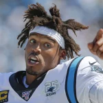 Carolina Panthers quarterback Cam Newton talks on the sidelines as the Panthers play the Los Angele