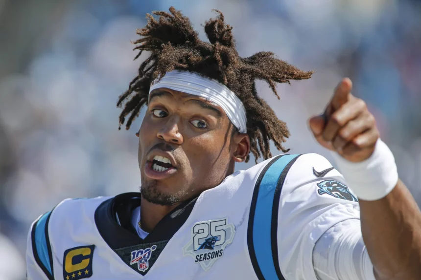 Carolina Panthers quarterback Cam Newton talks on the sidelines as the Panthers play the Los Angele