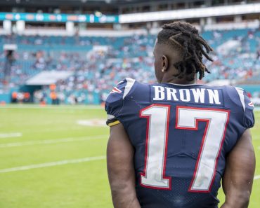 MIAMI GARDENS, FL - SEPTEMBER 15: New England Patriots Wide Receiver Antonio Brown (17) watches the game on the sidelin