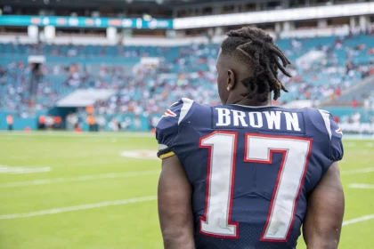 MIAMI GARDENS, FL - SEPTEMBER 15: New England Patriots Wide Receiver Antonio Brown (17) watches the game on the sidelin
