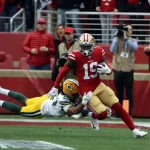 SANTA CLARA, CA - JANUARY 19: San Francisco 49ers Wide Receiver Deebo Samuel (19) runs through a tackle after a catch du