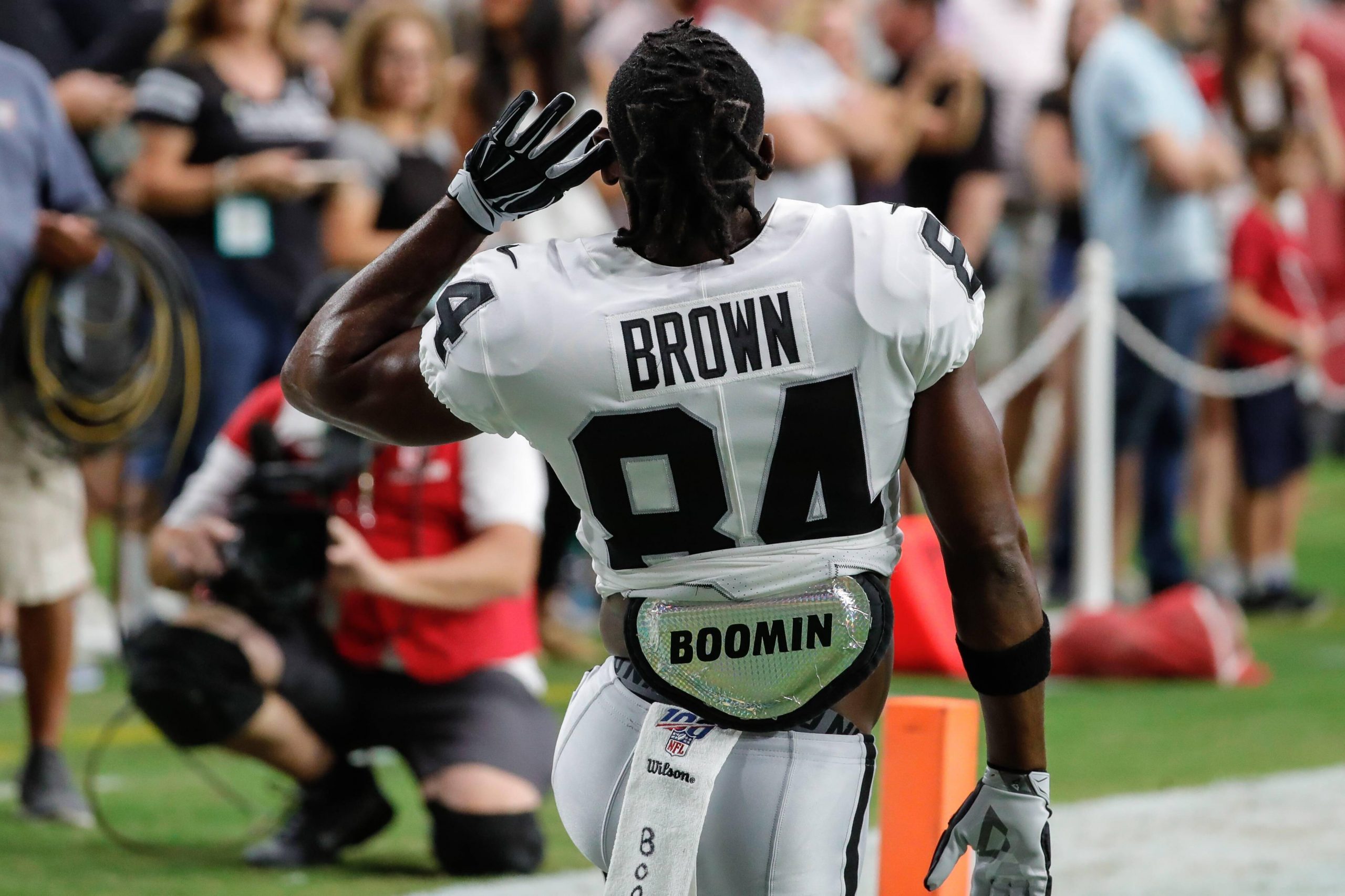 GLENDALE, AZ - AUGUST 15: Oakland Raiders wide receiver Antonio Brown (84) gestures to the crowd to get louder before t