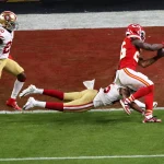 (200203) -- MIAMI, Feb. 3, 2020 -- Kansas City Chiefs player Damien Williams (1st R) scores a touchdown during the NFL,