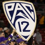 December 2 2016 Members of the Washington Huskies marching band hold up a Pac 12 logo sign during