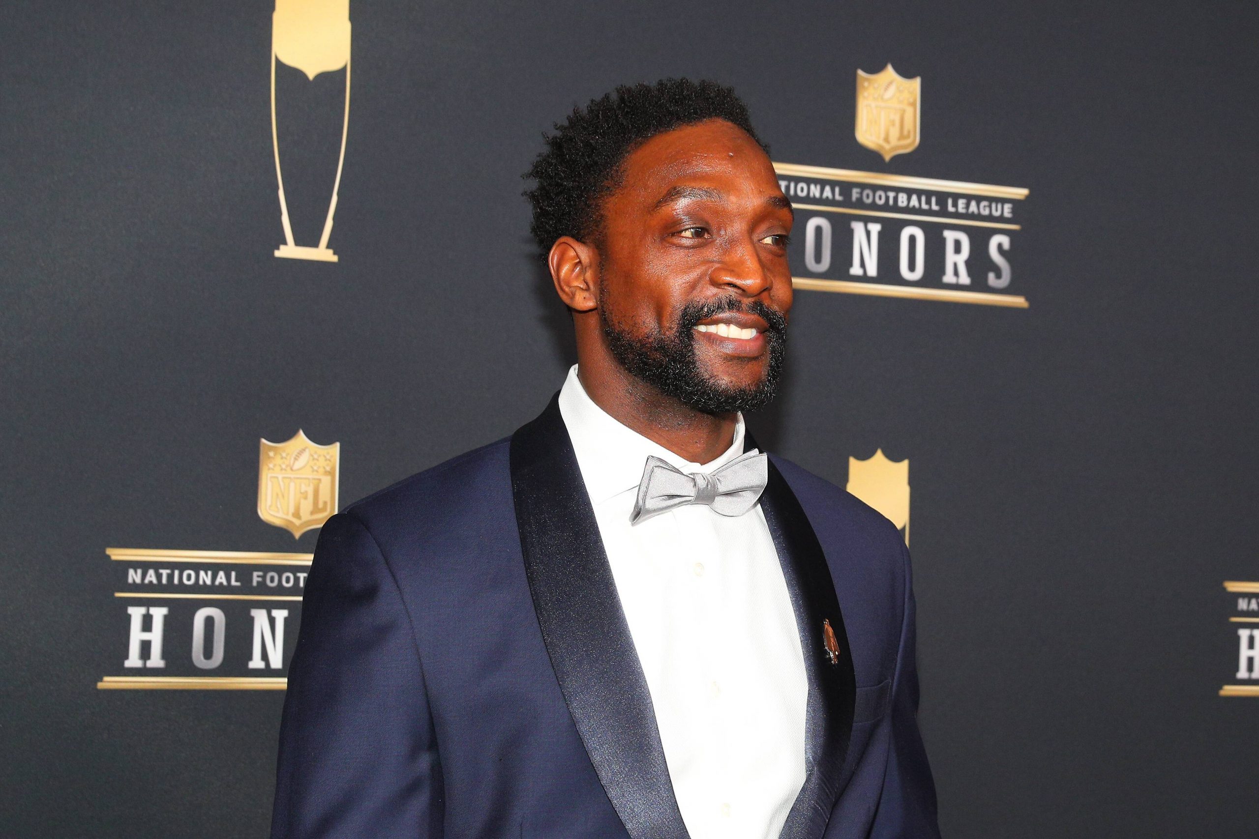 MINNEAPOLIS MN FEBRUARY 03 Charles Tillman poses for Photographs on the Red Carpet at NFL Americ