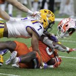 January 13, 2020, New Orleans, Louisiana, USA: 7 GRANT DELPIT, S of the LSU Tigers tackles 9 TRAVIS ETIENNE, RB of the C