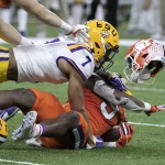 January 13, 2020, New Orleans, Louisiana, USA: 7 GRANT DELPIT, S of the LSU Tigers tackles 9 TRAVIS ETIENNE, RB of the C