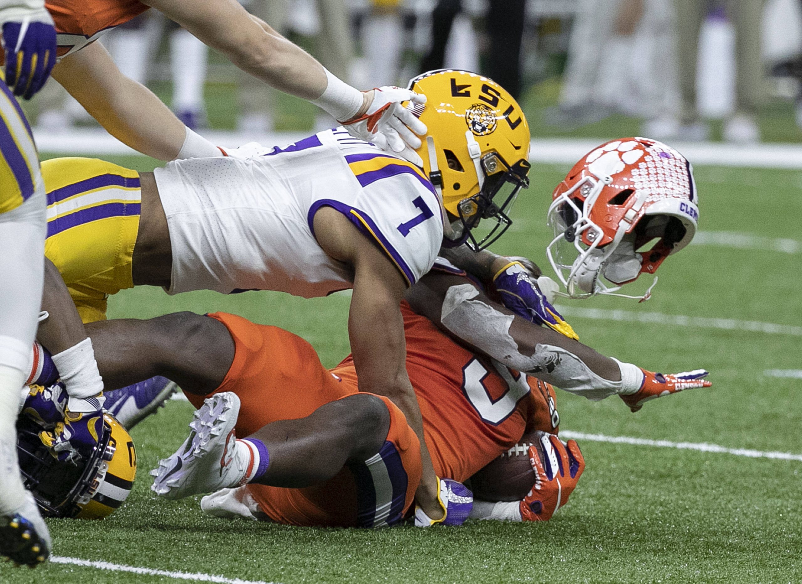 January 13, 2020, New Orleans, Louisiana, USA: 7 GRANT DELPIT, S of the LSU Tigers tackles 9 TRAVIS ETIENNE, RB of the C