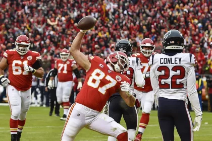 January 12, 2020, Kansas City, MO, USA: Kansas City Chiefs tight end Travis Kelce spikes the ball after scoring his firs
