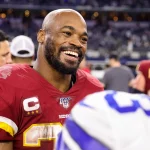 ARLINGTON, TX - DECEMBER 29: Washington Redskins Running Back Adrian Peterson (26) talks with players after the NFC East