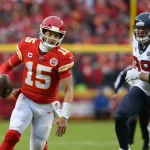 KANSAS CITY, MO - JANUARY 12: Kansas City Chiefs quarterback Patrick Mahomes (15) runs past Houston Texans defensive en