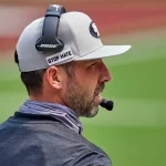 SAN FRANCISCO, CA - SEPTEMBER 13: San Francisco 49ers head coach Kyle Shanahan talks into his headset during the NFL, Am