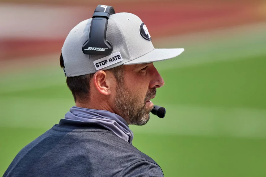 SAN FRANCISCO, CA - SEPTEMBER 13: San Francisco 49ers head coach Kyle Shanahan talks into his headset during the NFL, Am