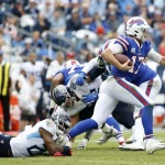 NASHVILLE, TN - OCTOBER 06: Buffalo Bills quarterback Josh Allen (17) escapes a tackle of Tennessee Titans cornerback Ma