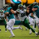 October 27, 2019, Jacksonville, Florida, USA: Jacksonville Jaguars quarterback GARDNER MINSHEW (15) escapes the reach of