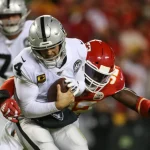 KANSAS CITY, MO - DECEMBER 01: Oakland Raiders quarterback Derek Carr (4) is sacked by Kansas City Chiefs defensive end