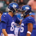 NJ - DECEMBER 29: New York Giants quarterback Daniel Jones (8) and New York Giants running back Saquon Barkley