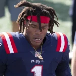 New England Patriots quarterback Cam Newton (1) heads off the field at the end of the game against the Miami Dolphins a