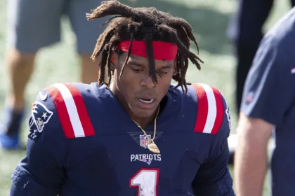 New England Patriots quarterback Cam Newton (1) heads off the field at the end of the game against the Miami Dolphins a