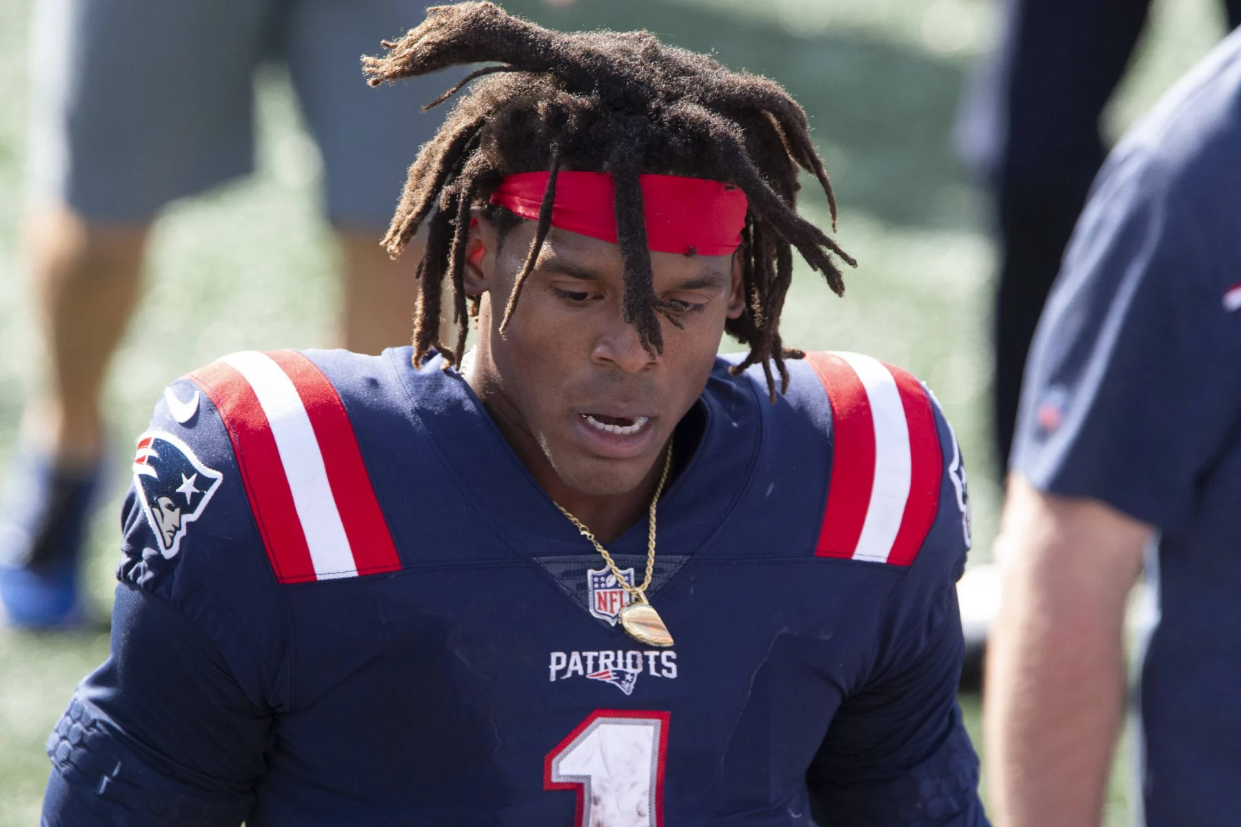 New England Patriots quarterback Cam Newton (1) heads off the field at the end of the game against the Miami Dolphins a