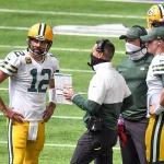 MINNEAPOLIS, MN - SEPTEMBER 13: Green Bay Packers Quarterback Aaron Rodgers (12) talks with Green Bay Packers Head Coach