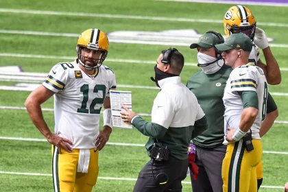 MINNEAPOLIS, MN - SEPTEMBER 13: Green Bay Packers Quarterback Aaron Rodgers (12) talks with Green Bay Packers Head Coach