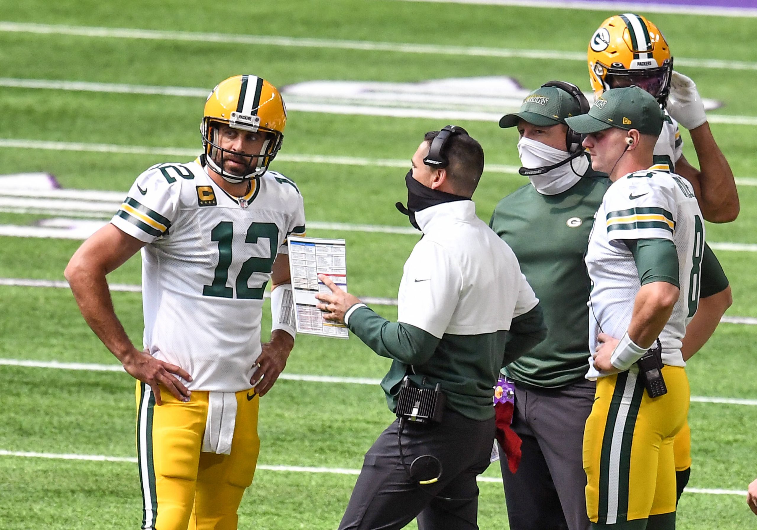 MINNEAPOLIS, MN - SEPTEMBER 13: Green Bay Packers Quarterback Aaron Rodgers (12) talks with Green Bay Packers Head Coach