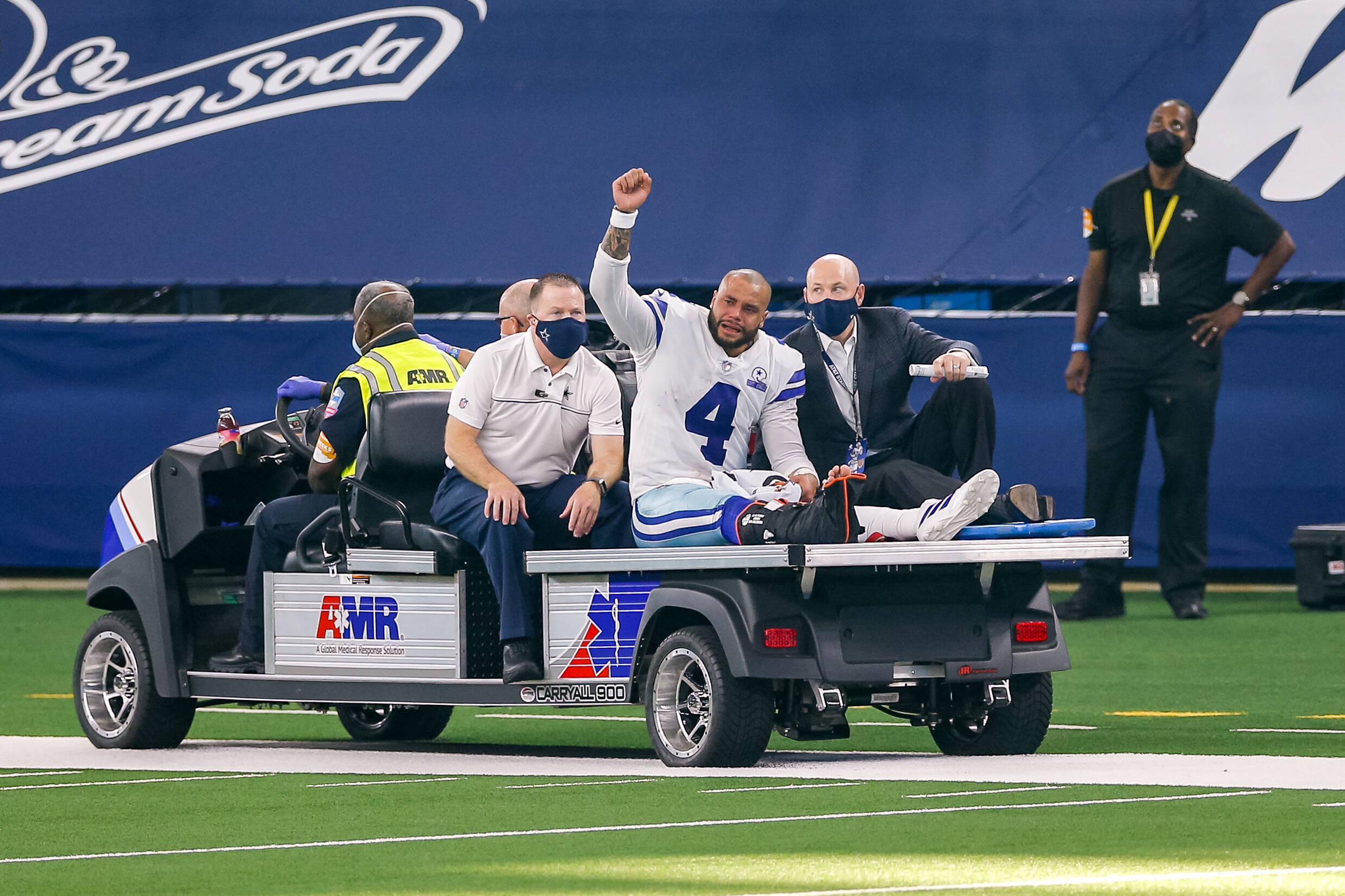 ARLINGTON, TX - OCTOBER 11: Dallas Cowboys Quarterback Dak Prescott (4) is carted off the field after suffering a leg i