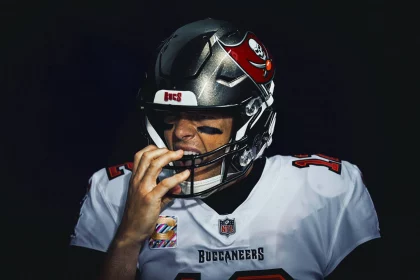CHICAGO, IL - OCTOBER 08: Tampa Bay Buccaneers Quarterback Tom Brady (12) adjusts his helmet prior to game action for a