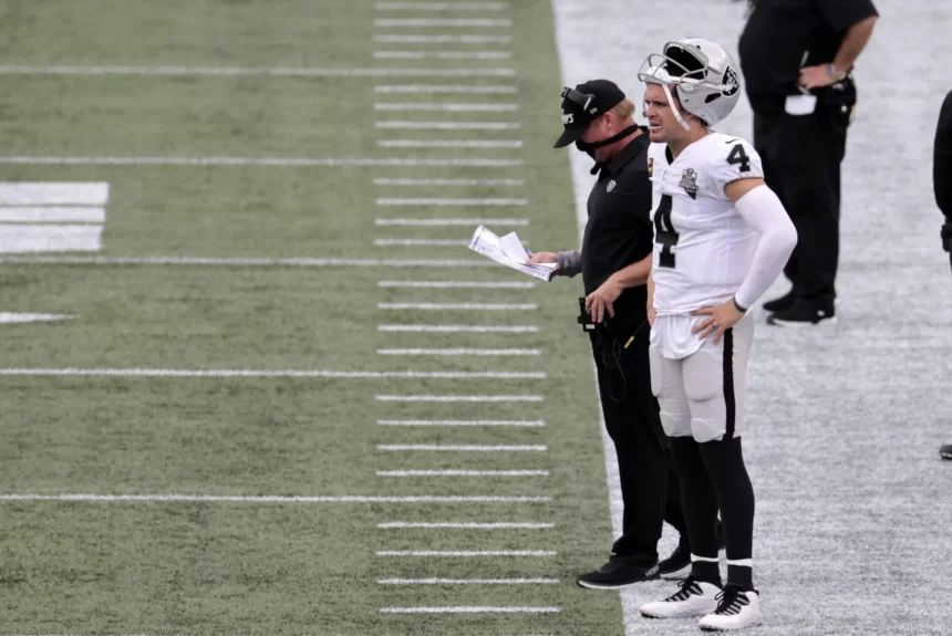 FOXBOROUGH, MA - SEPTEMBER 27: Las Vegas Raiders head coach Jon Gruden and Las Vegas Raiders quarterback Derek Carr (4)
