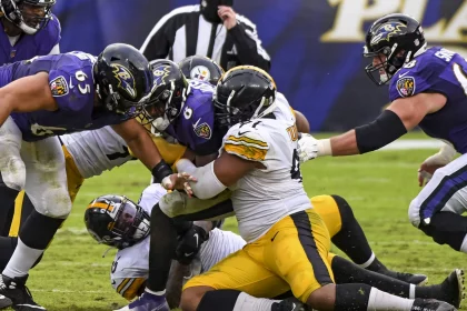 BALTIMORE, MD - NOVEMBER 01: Baltimore Ravens quarterback Lamar Jackson (8) is sacked by Pittsburgh Steelers defensive e