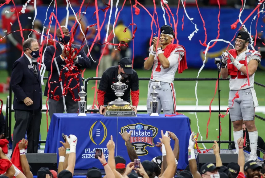 January 1, 2021: Ohio State Head Coach Ryan Day along with Offensive MVP Justin Fields (1) and Defensive MVP Tuf Borland