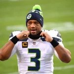 Seattle Seahawks quarterback Russell Wilson (3) leaves the field after the Seahawks defeated the Washington Football Tea
