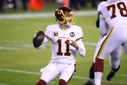 PHILADELPHIA, PA - JANUARY 03: Washington Football Team Quarterback Alex Smith (11) throws a pass in the first half duri