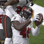 January 17, 2021, Landover, Florida, USA: Tampa Bay Buccaneers inside linebacker Devin White (45) fumble recovery durin