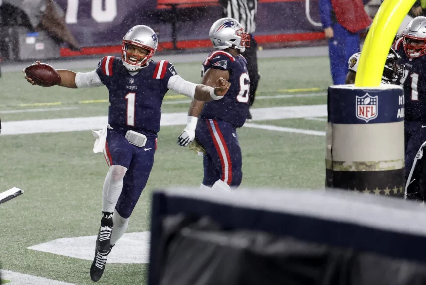 FOXBOROUGH, MA - NOVEMBER 15: New England Patriots quarterback Cam Newton (1) celebrates scoring six during a game betw