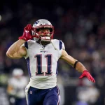 HOUSTON, TX - DECEMBER 01: New England Patriots wide receiver Julian Edelman (11) runs onto the field before the game be