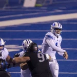 November 6, 2020, Boise, ID, USA: BYU quarterback Zach Wilson, right, has plenty of time to pass with his offensive line