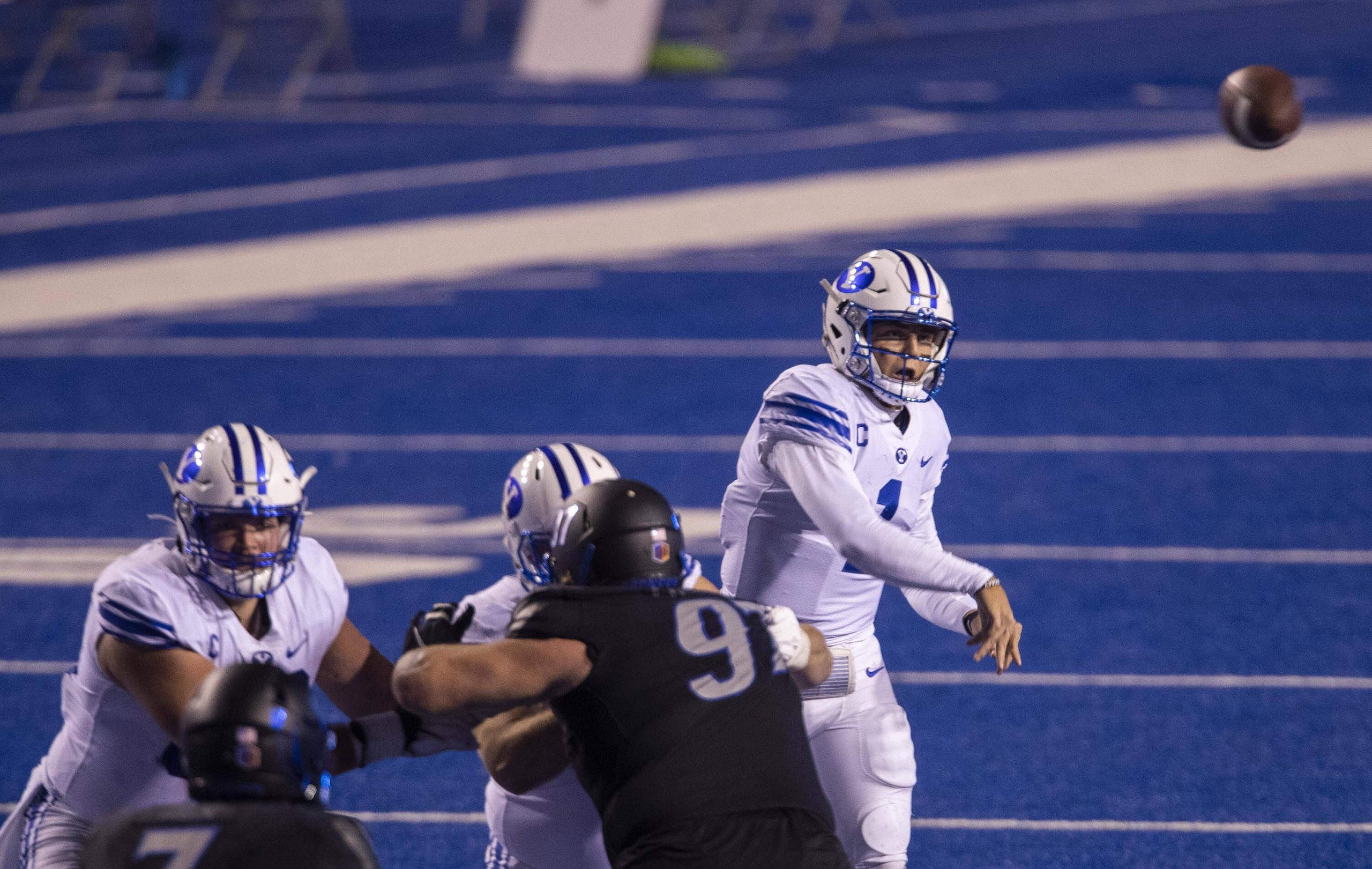 November 6, 2020, Boise, ID, USA: BYU quarterback Zach Wilson, right, has plenty of time to pass with his offensive line