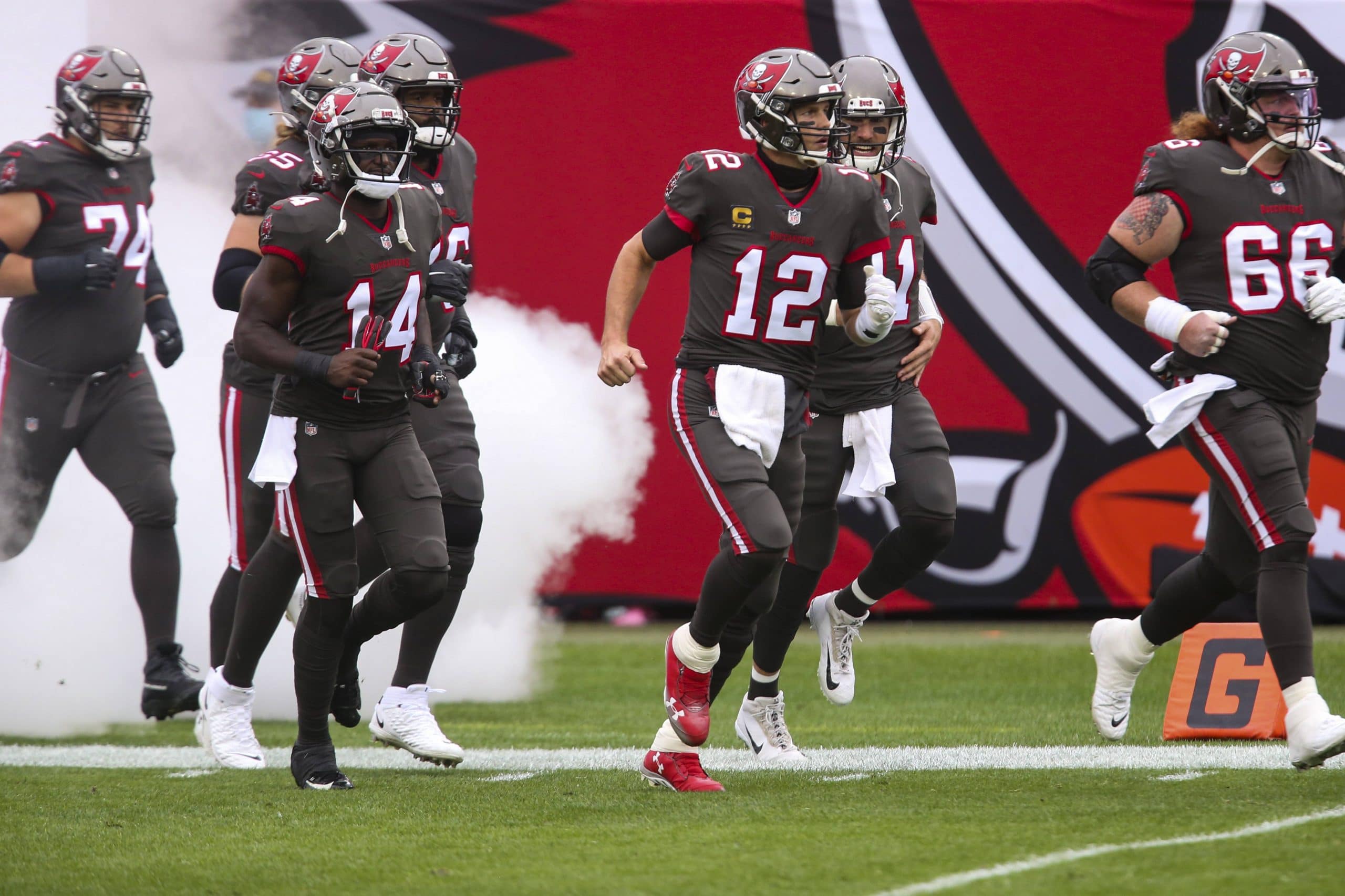 January 3, 2021, Tampa, Florida, USA: Tampa Bay Buccaneers quarterback Tom Brady (12) makes his way to the field during