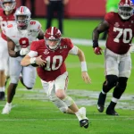 January 11, 2021: Alabama Crimson Tide quarterback Mac Jones (10) running the ball at the NCAA, College League, USA Foot