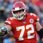 KANSAS CITY, MO - JANUARY 19: Kansas City Chiefs offensive tackle Eric Fisher (72) looks to fist bump a teammate in the
