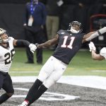 ATLANTA, GA - DECEMBER 06: The football slips through the hands of wide receiver Julio Jones 11 of the Atlanta Falcons